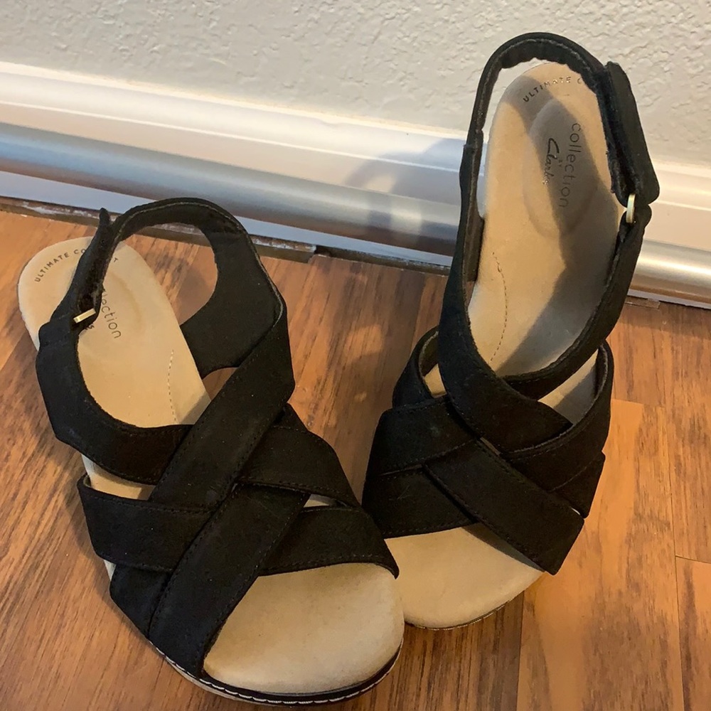 3” black wedge cork heels by Clarks, crisscross straps around toes and ankle. 8